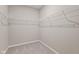 Clean walk-in closet featuring neutral paint, shelving, and carpeted floors at 2184 Galleone Way, Plainfield, IN 46168