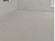 Spacious room with clean white walls and painted floor ready to become whatever you desire at 1155 S Rangeline Rd # 504, Carmel, IN 46032