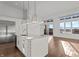 Bright kitchen with white cabinetry, quartz countertops, gold hardware, stainless appliances at 1155 S Rangeline Rd # 504, Carmel, IN 46032