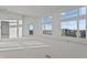 Bright, spacious living room with large windows and abundant natural light, awaiting personalization and finishing touches at 1155 S Rangeline Rd # 504, Carmel, IN 46032