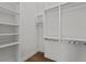 Bright walk-in closet with built-in shelving and hanging rods, offering ample storage at 1155 S Rangeline Rd # 504, Carmel, IN 46032