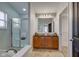 Bathroom with double sinks, large mirror, and shower at 12106 Cabri Ln, Fishers, IN 46037