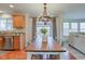 Bright dining area with farmhouse table and view of the backyard at 12106 Cabri Ln, Fishers, IN 46037