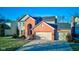 Brick two-story house with attached two-car garage at 12106 Cabri Ln, Fishers, IN 46037