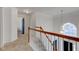 Upstairs hallway with carpeted floor and railing at 12106 Cabri Ln, Fishers, IN 46037