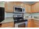 Stainless steel appliances and granite countertops highlight this kitchen at 12106 Cabri Ln, Fishers, IN 46037