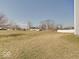 Expansive backyard with green and yellow grass, providing ample space for outdoor activities at 2898 Creekridge Ct, Columbus, IN 47201