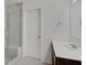 Bathroom featuring a modern vanity, sink, and a glass-enclosed shower with tiled walls and a built-in seat at 2898 Creekridge Ct, Columbus, IN 47201