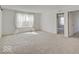 Bright bedroom with carpet, natural light from the window, and access to the bathroom and walk-in closet at 2898 Creekridge Ct, Columbus, IN 47201