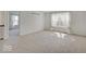 Bright bedroom with carpet, natural light from the window, and access to another room at 2898 Creekridge Ct, Columbus, IN 47201
