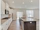 Spacious kitchen features a large island, white cabinets, and stainless steel appliances at 2898 Creekridge Ct, Columbus, IN 47201