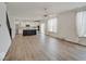 Spacious, open living area showcases hardwood floors, large windows, and seamless access to the kitchen at 2898 Creekridge Ct, Columbus, IN 47201