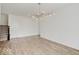 Open-concept room features hard wood flooring and a stairway leading to the upper level at 2898 Creekridge Ct, Columbus, IN 47201