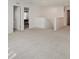 Open loft featuring neutral carpet and lots of light and access to other rooms at 2898 Creekridge Ct, Columbus, IN 47201