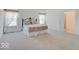 Spacious main bedroom with a decorative metal bed frame, ensuite access and natural light at 2898 Creekridge Ct, Columbus, IN 47201