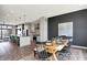 Open-concept dining room adjacent to the kitchen with wood table and seating for six at 82 E Wayne St # C, Franklin, IN 46131