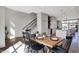 Dining area with wood table and chairs between kitchen and staircase at 82 E Wayne St # C, Franklin, IN 46131