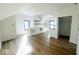 Open concept kitchen with white cabinets and hardwood floors at 2133 N Talbott St, Indianapolis, IN 46202