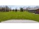 A sprawling green backyard with an outdoor living space is perfect for recreation at 4499 W 131St St, Carmel, IN 46074