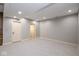 A large carpeted basement area with two white doors at 4499 W 131St St, Carmel, IN 46074