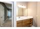 Modern bathroom vanity with a white countertop, wood cabinets and a view into a hallway at 4499 W 131St St, Carmel, IN 46074