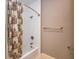 Bathroom featuring a tub with a shower curtain, a shower head, and a towel bar at 4499 W 131St St, Carmel, IN 46074
