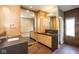 Bright bathroom featuring a wooden vanity with double sinks and a large mirror at 4499 W 131St St, Carmel, IN 46074