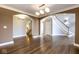 Open concept entryway offers hardwood floors and a staircase with a view of other rooms at 4499 W 131St St, Carmel, IN 46074