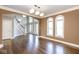 Spacious entryway features hardwood floors, large windows, and a staircase leading to the upper level at 4499 W 131St St, Carmel, IN 46074