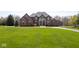 Beautiful brick home with manicured lawn and well maintained landscaping at 4499 W 131St St, Carmel, IN 46074