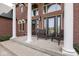 Inviting front porch with columns and seating at 4499 W 131St St, Carmel, IN 46074