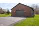 Detached two-car garage featuring brick accents and a well-maintained driveway at 4499 W 131St St, Carmel, IN 46074