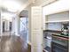 Hallway view of the home's design, including an open concept floor plan, hardwood flooring and staircase at 4499 W 131St St, Carmel, IN 46074