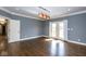 This living room has hardwood flooring, French doors, and neutral color scheme at 4499 W 131St St, Carmel, IN 46074