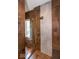 Modern walk-in shower showcasing decorative tile, glass door, and updated fixtures at 4499 W 131St St, Carmel, IN 46074