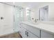 Modern bathroom featuring a glass shower, bright vanity with white countertop, and stylish fixtures at 806 7Th St, Columbus, IN 47201