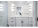 Bright bathroom showcasing a glass-enclosed shower and a sleek white vanity with modern fixtures at 806 7Th St, Columbus, IN 47201
