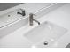 A white bathroom sink features a modern faucet and a sleek mirror on a white countertop at 806 7Th St, Columbus, IN 47201