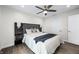 Bright bedroom featuring a large bed with a stylish headboard and modern ceiling fan at 806 7Th St, Columbus, IN 47201