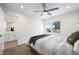 Bright bedroom featuring a large bed, ceiling fan and an ensuite bathroom at 806 7Th St, Columbus, IN 47201