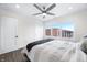 Bright bedroom featuring large windows, modern ceiling fan, and minimalist decor at 806 7Th St, Columbus, IN 47201