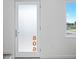 Bright entryway featuring frosted glass door with address and adjacent window for natural light at 806 7Th St, Columbus, IN 47201