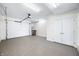 A spacious two car garage features an epoxy floor, storage closet, and automatic garage door opener at 806 7Th St, Columbus, IN 47201