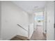 Hallway featuring wood floors and leading to a bright window and bedroom area at 806 7Th St, Columbus, IN 47201