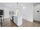 Bright kitchen showcasing an island with seating, sleek countertops, and stainless steel appliances at 806 7Th St, Columbus, IN 47201