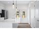 Kitchen with stainless steel appliances, island sink and quartz countertops with a bright window view at 806 7Th St, Columbus, IN 47201