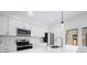 Modern kitchen featuring stainless steel appliances, sleek white cabinets and a stylish faucet at 806 7Th St, Columbus, IN 47201
