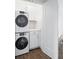 Laundry room with stacked washer and dryer, providing efficient space-saving convenience at 806 7Th St, Columbus, IN 47201