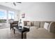 Bright living room with large windows and modern furnishings, including a comfortable sectional sofa at 806 7Th St, Columbus, IN 47201