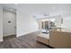 Open living room with hard surface floors, large windows, and neutral sofa at 806 7Th St, Columbus, IN 47201